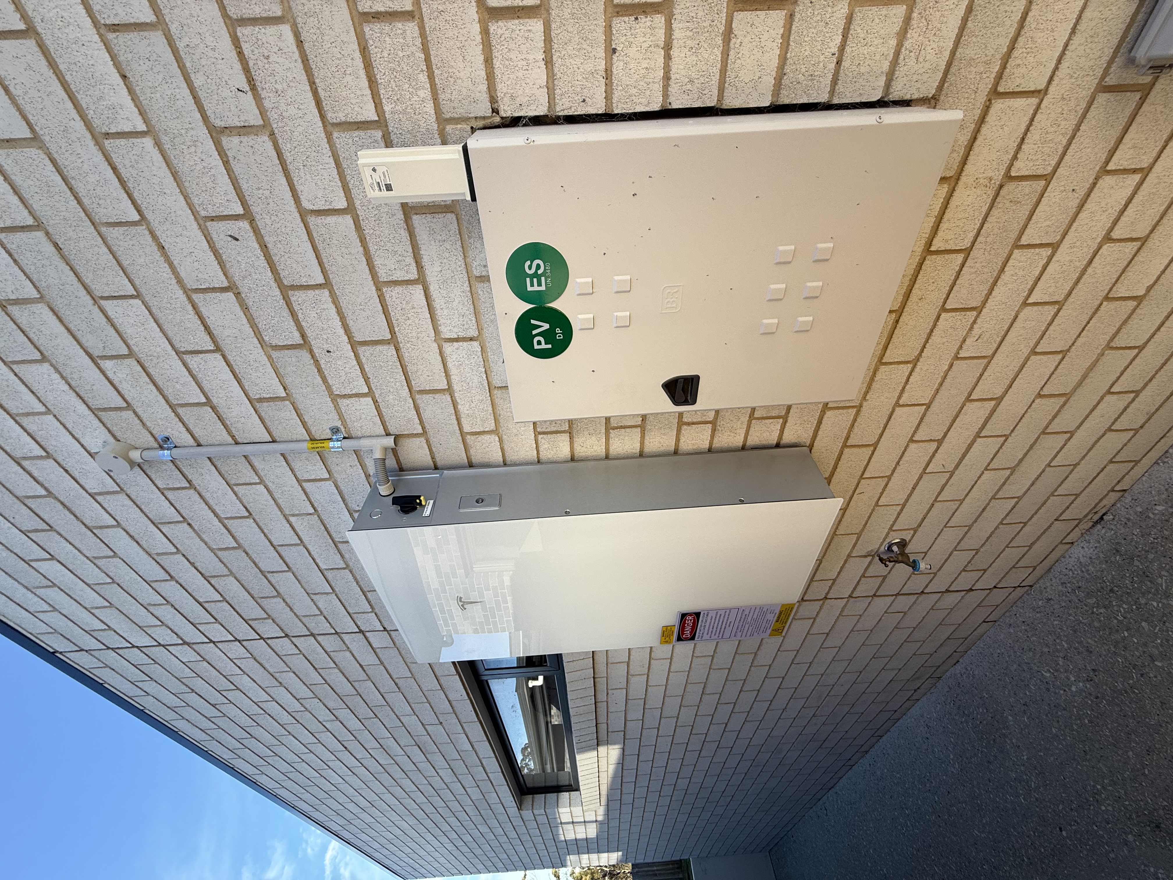 Battery and solar metering switchboard on brick wall